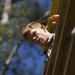 Army Ranger climbs down an obstacle