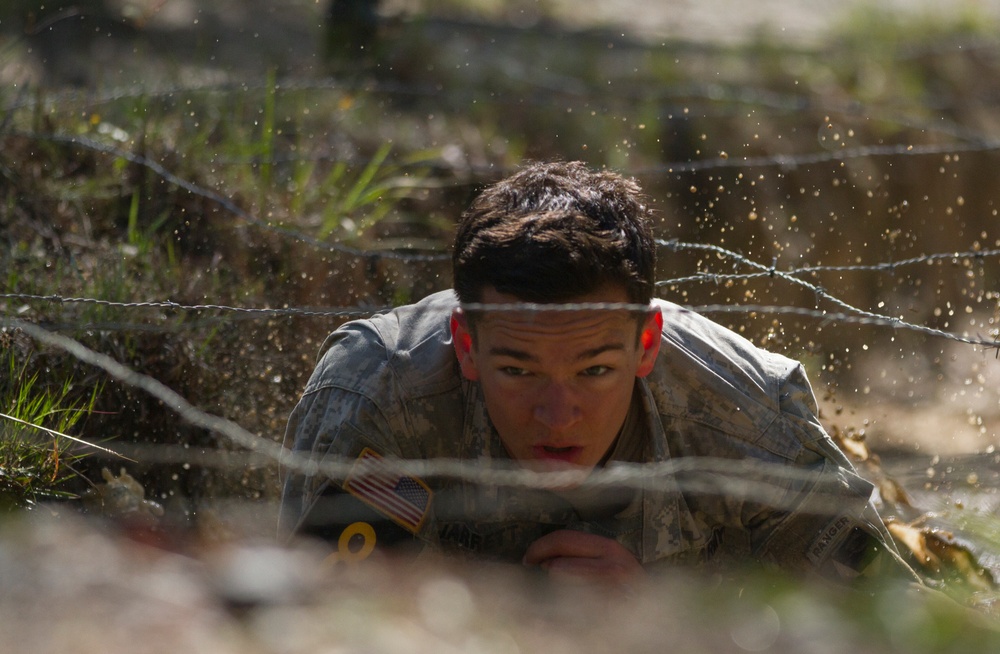 Army Ranger moves through obstacle