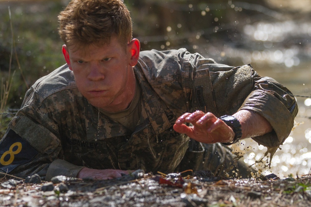 Army Ranger moves through obstacle