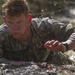 Army Ranger moves through obstacle