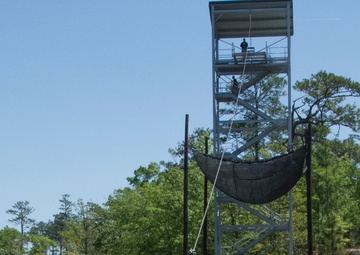 Army Ranger slides down zip line