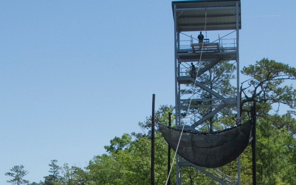 Army Ranger slides down zip line
