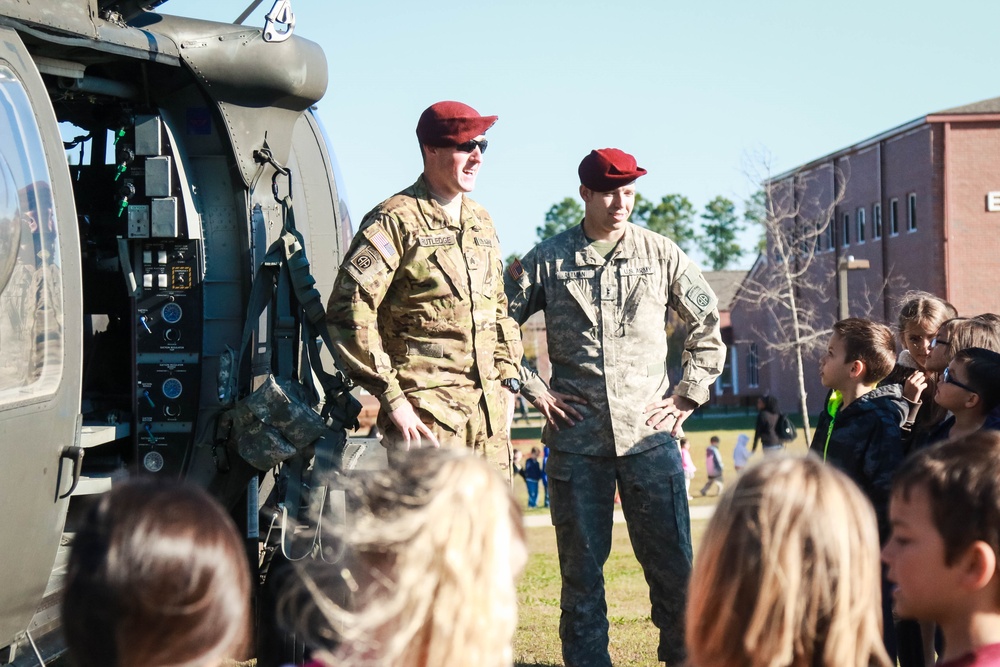 Pilot and crew chief speak with students