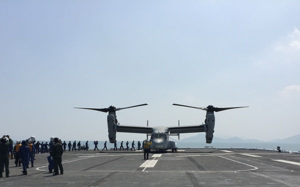 Marine Corps Ospreys launch from Japanese ships to support earthquake relief