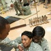 Learning to teach others to fight