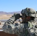 Soldier observes an area for enemy forces