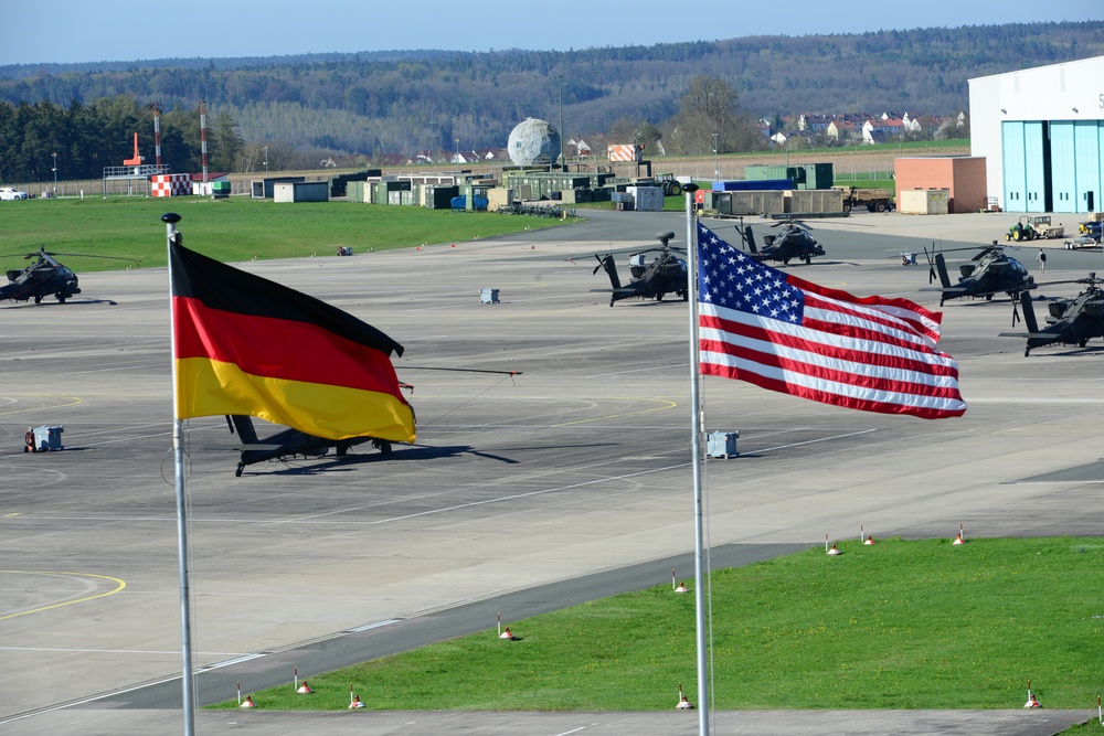 US and German flags fly outside 12th Combat Aviation Brigade Headquarters