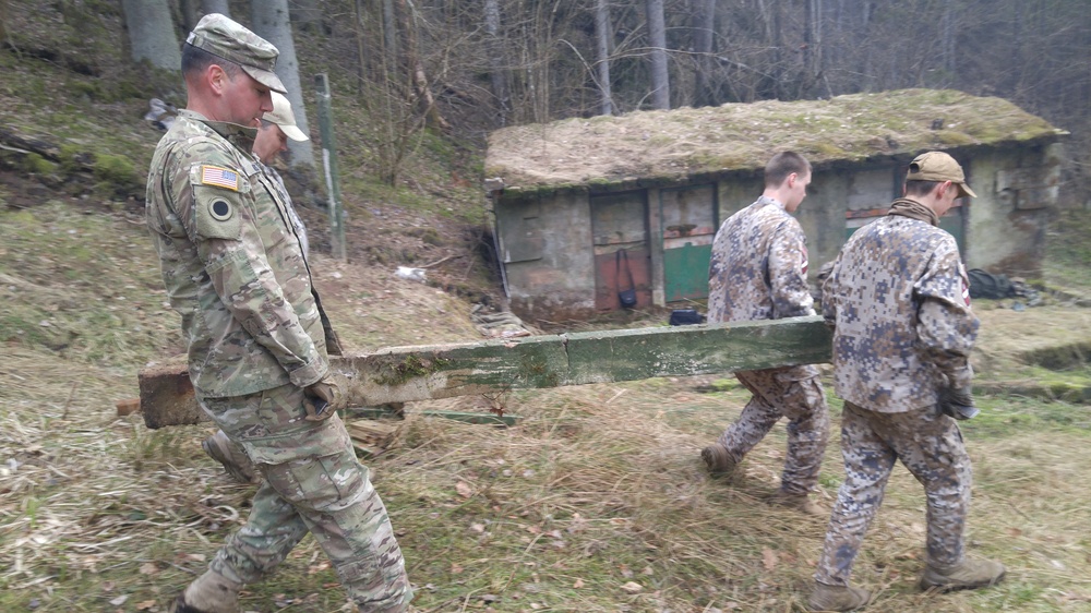 Michigan's 119th Field Artillery assists clean-up of Latvian park