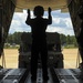 RAAF Airmen work with U.S. Air Force Airmen to deliver cargo