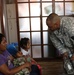 Soldier visits with family rescued from fire