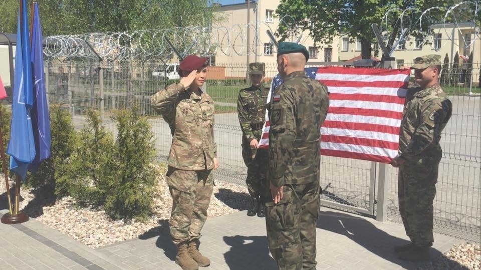 U.S. Army Capt. Briana Bailey salutes Polish Army Col. Artur Bogowicz
