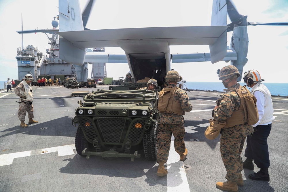 U.S. Marines Prepare to board an MV-22 Osprey