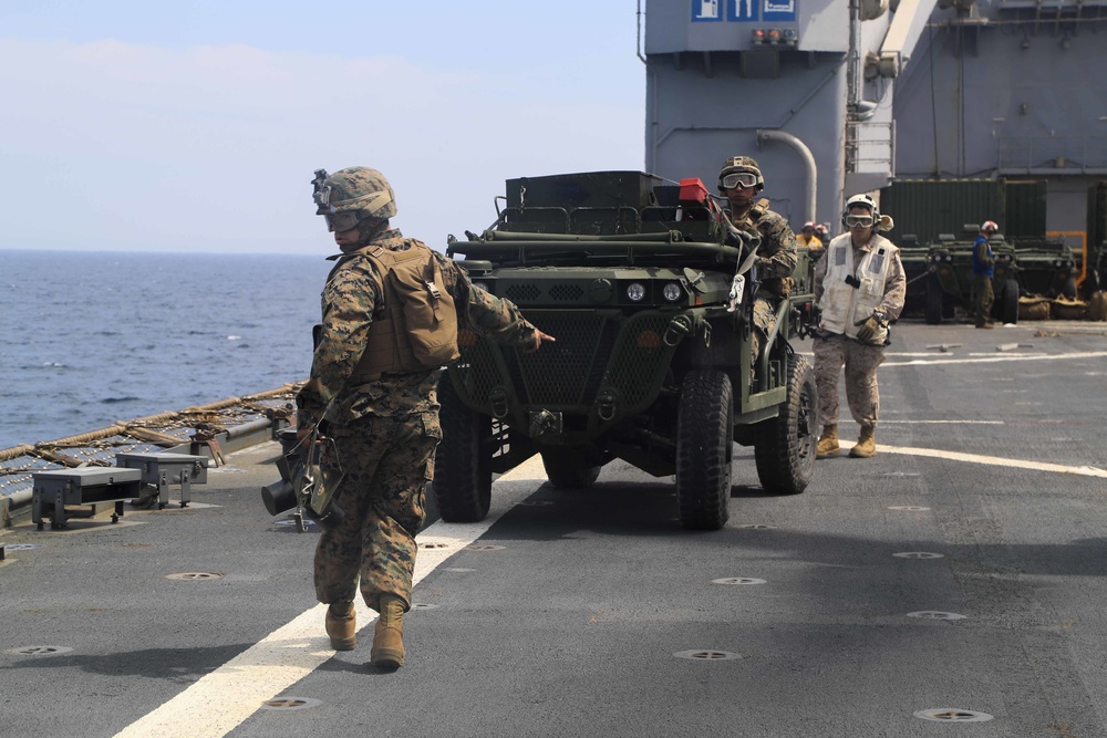 U.S. Marines Prepare to board an MV-22 Osprey