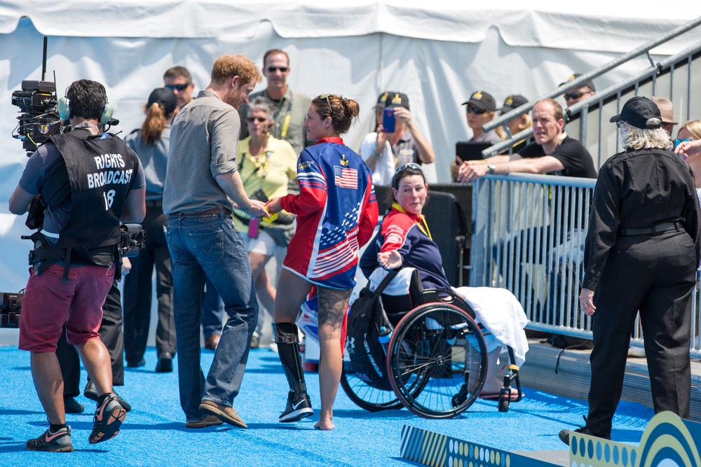 Elizabeth Marks gives Prince Harry her medal