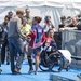 Elizabeth Marks gives Prince Harry her medal