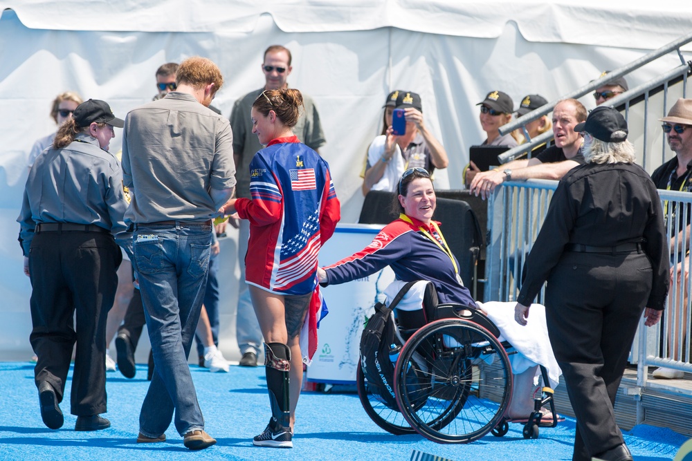 Elizabeth Marks gives Prince Harry her medal