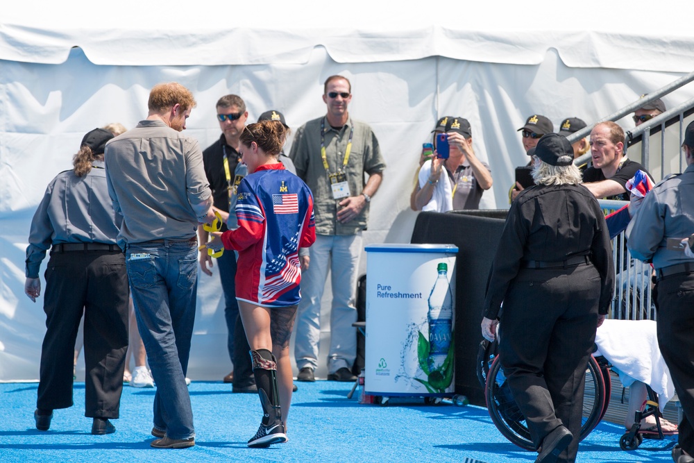 Elizabeth Marks gives Prince Harry her medal