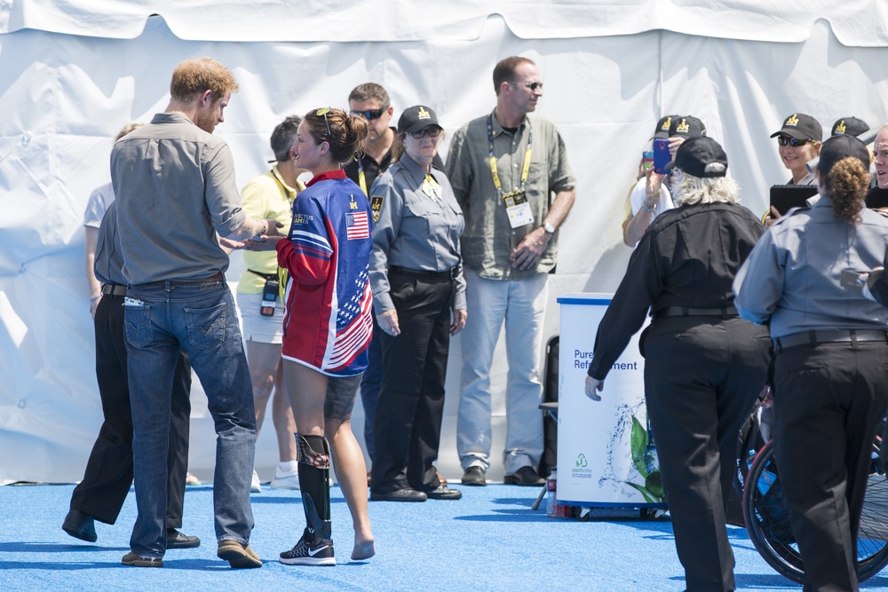 Elizabeth Marks gives Prince Harry her medal