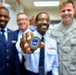 Airman presented a token of superior performance