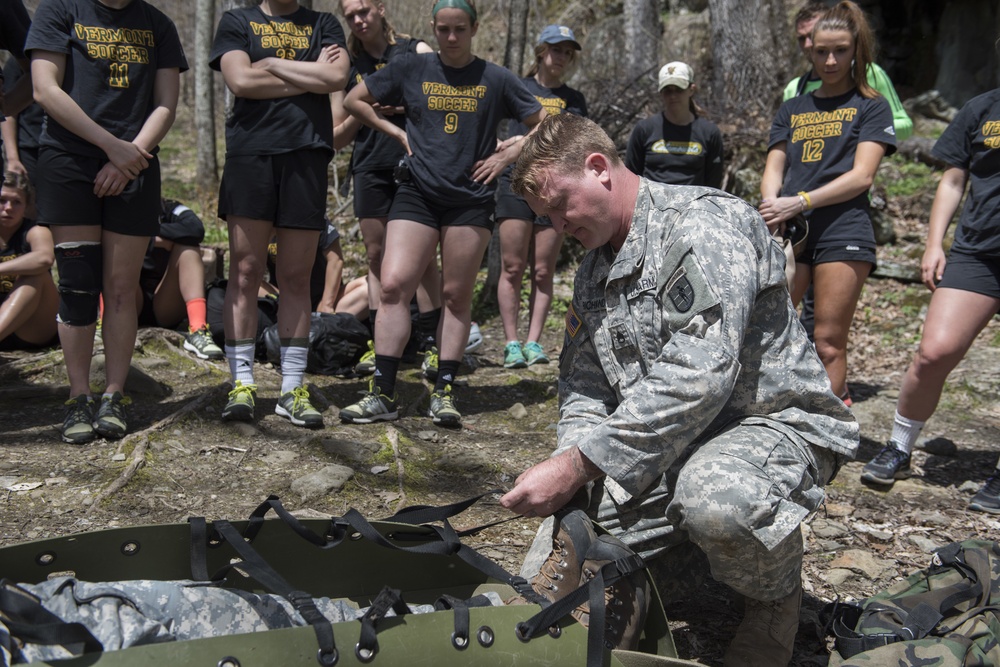 Army Mountain Warfare School Instructor Securing a Casualty to a Litter