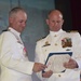 Capt. Jeffrey Grimes presents Cmdr. Lance Thompson the Legion of Merit