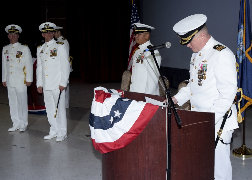 Cmdr. Brian Turney makes his first remarks as commanding officer of USS Chicago (SSN 721) during the change of command ceremony at Naval Base Guam May 12