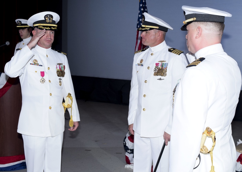 Cmdr. Brian Turney relieves Cmdr. Lance Thompson as commanding officer of USS Chicago (SSN 721) during a ceremony May 12