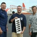 NOAA present Coast Guard crew with special Hawaiian monk seal decals for assisting with conservation efforts