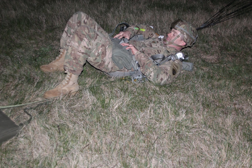 412th Paratrooper Lands during Night Jump