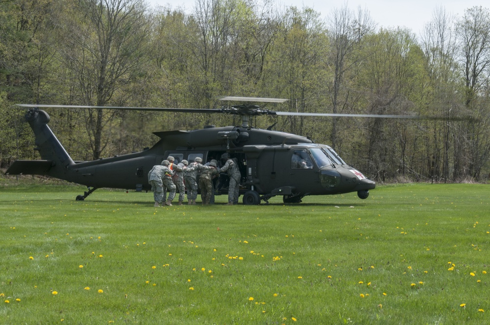 Crew Chief Directs Soldiers Boarding a Black Hawk