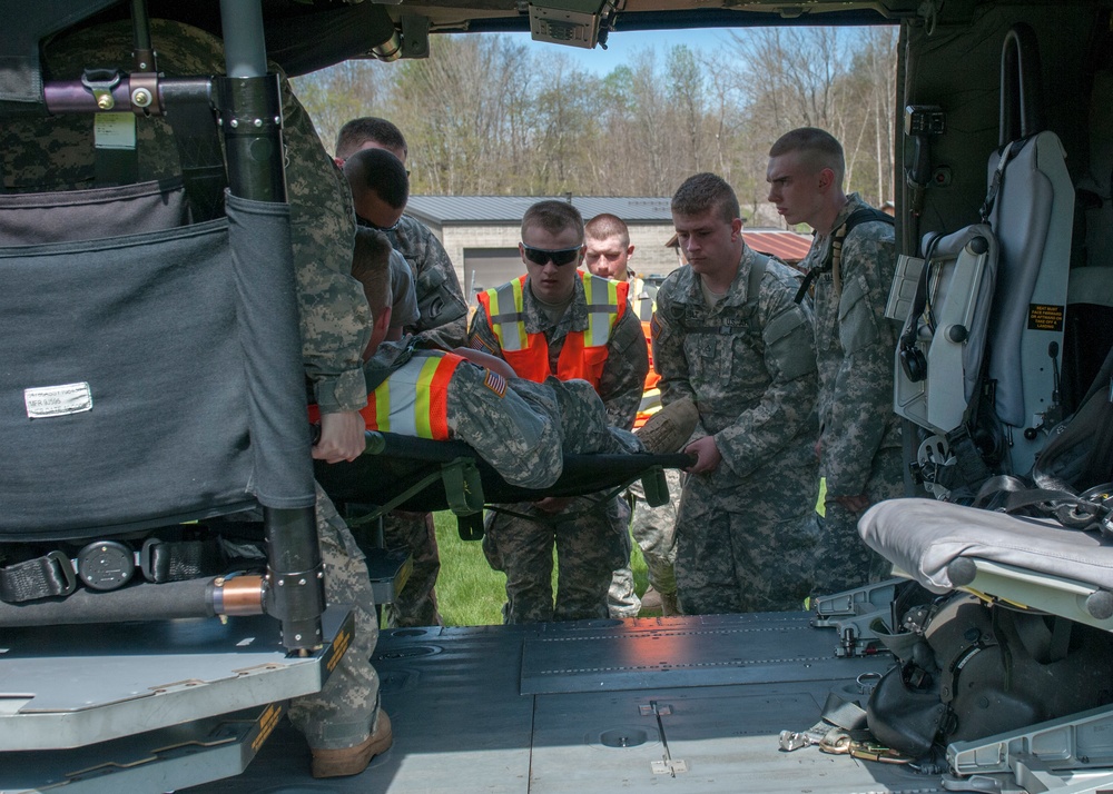 Soldiers Load a Mock Casualty onto a Black Hawk