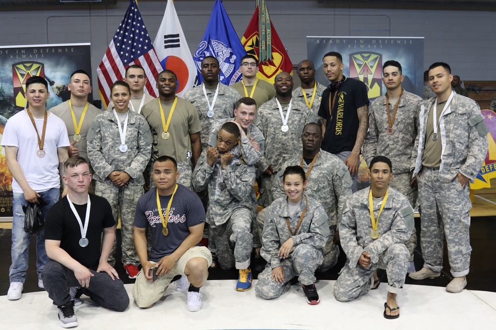 Soldiers pose after winning medals at annual Modern Army Combatives Tournament