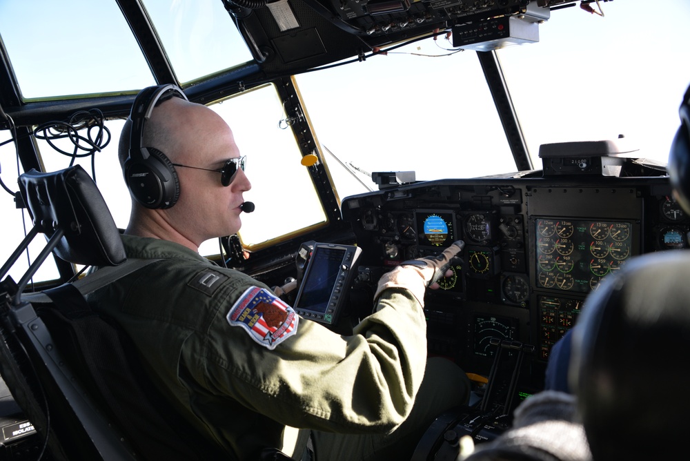 Coast Guard HC-130 Hercules aircraft pilot performs in-flight operations
