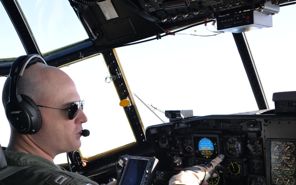 Coast Guard HC-130 Hercules aircraft pilot performs in-flight operations