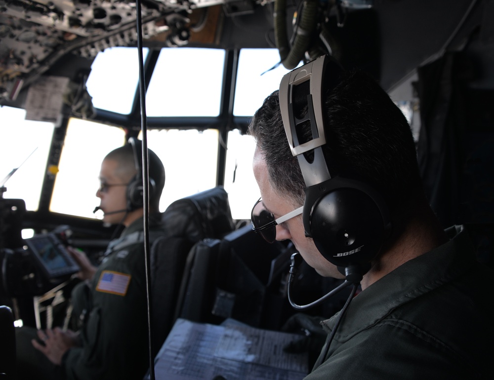 Coast Guard HC-130 aircrew conducts in-flight operations