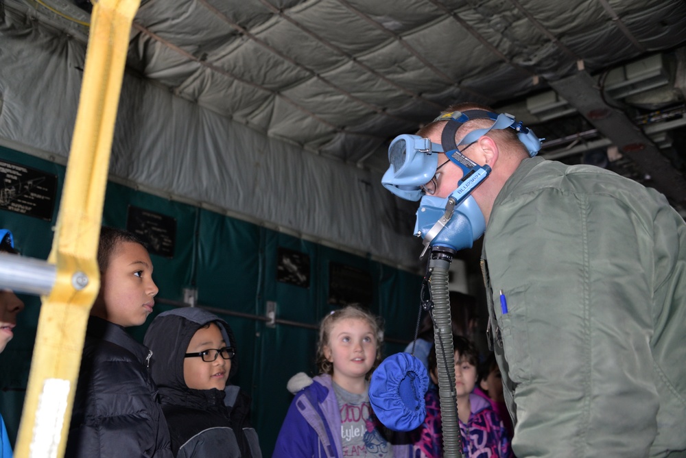 Coast Guard HC-130 Aircrew works with Children in Sand Point, Alaska