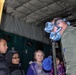 Coast Guard HC-130 Aircrew works with Children in Sand Point, Alaska