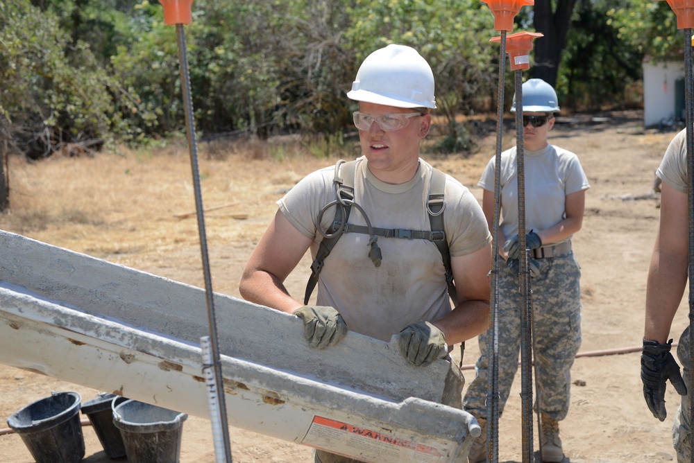 Soldier waits for cement to pour