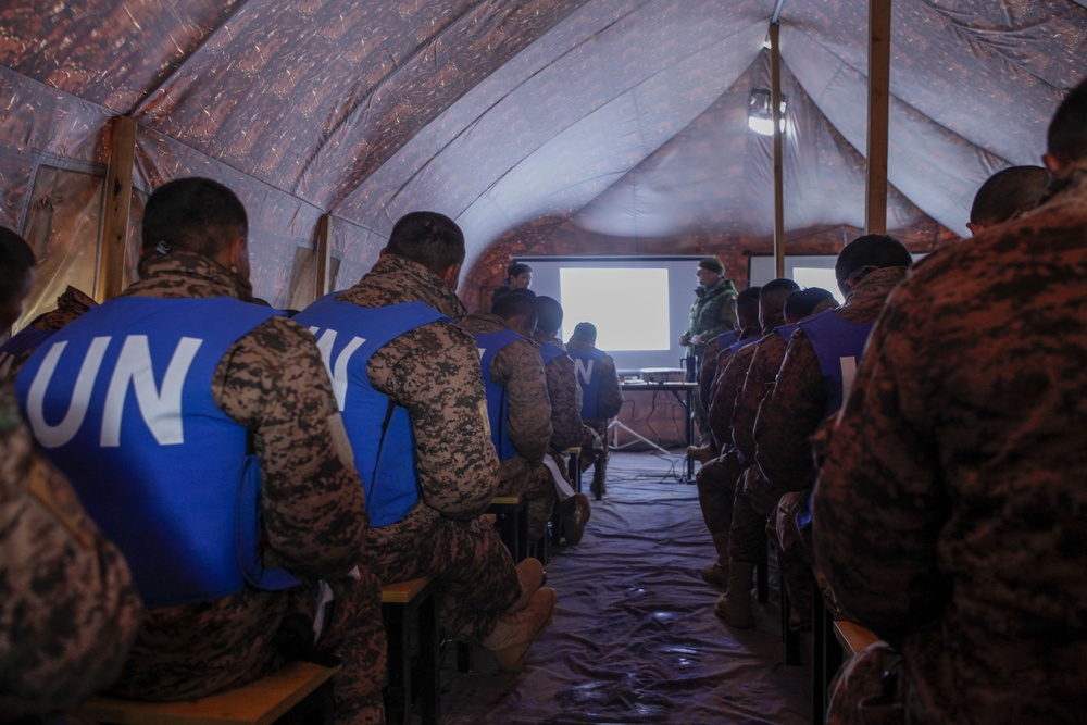 Soldiers with the Mongolian Armed Forces participate in minefield self-extraction training during Khaan Quest 2016