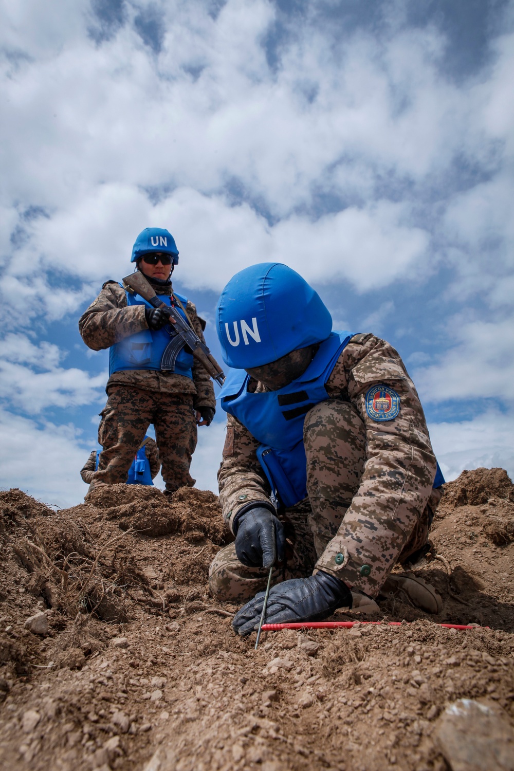 Soldiers with the Mongolian Armed Forces participate in minefield self-extraction training during Khaan Quest 2016