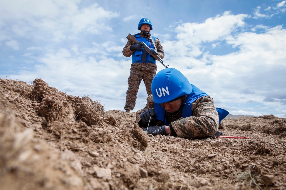 Soldiers with the Mongolian Armed Forces participate in minefield self-extraction training during Khaan Quest 2016