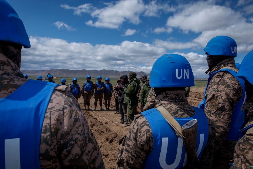 Soldiers with the Mongolian Armed Forces participate in minefield self-extraction training during Khaan Quest 2016