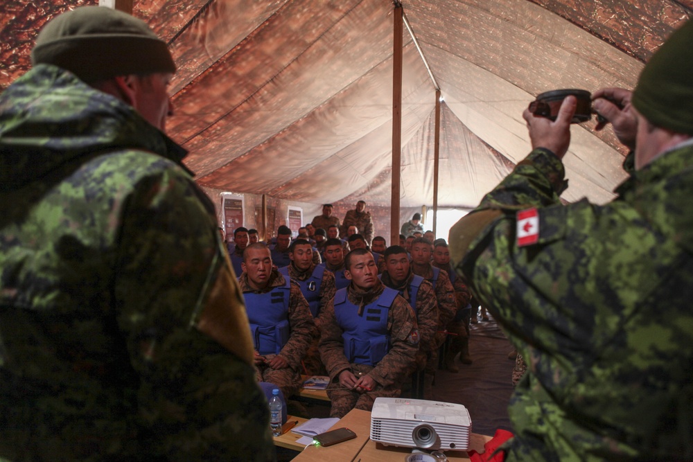 Soldiers with the Mongolian Armed Forces participate in minefield self-extraction training during Khaan Quest 2016