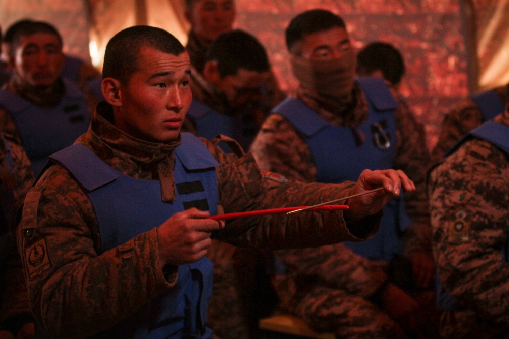 Soldiers with the Mongolian Armed Forces participate in minefield self-extraction training during Khaan Quest 2016