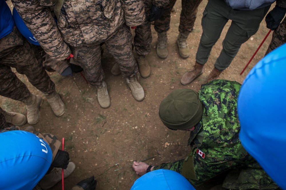 Soldiers with the Mongolian Armed Forces participate in minefield self-extraction training during Khaan Quest 2016