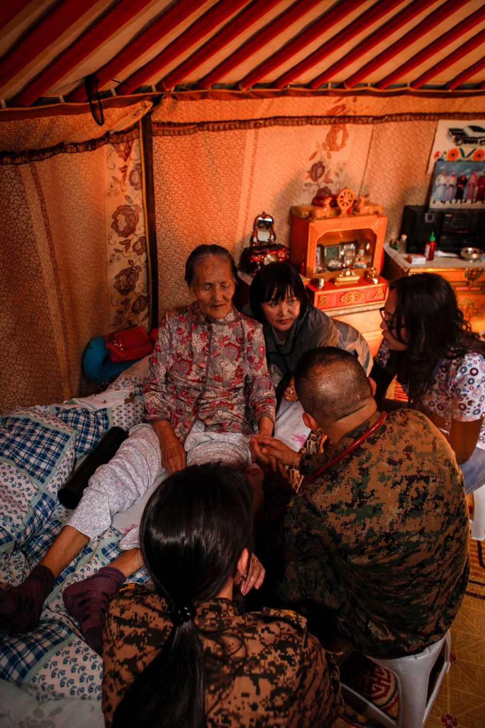 U.S. and Mongolian service members conduct medical care home visits in support of Khaan Quest 2016