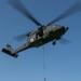 Black Hawk Lifts Off with Sling Load