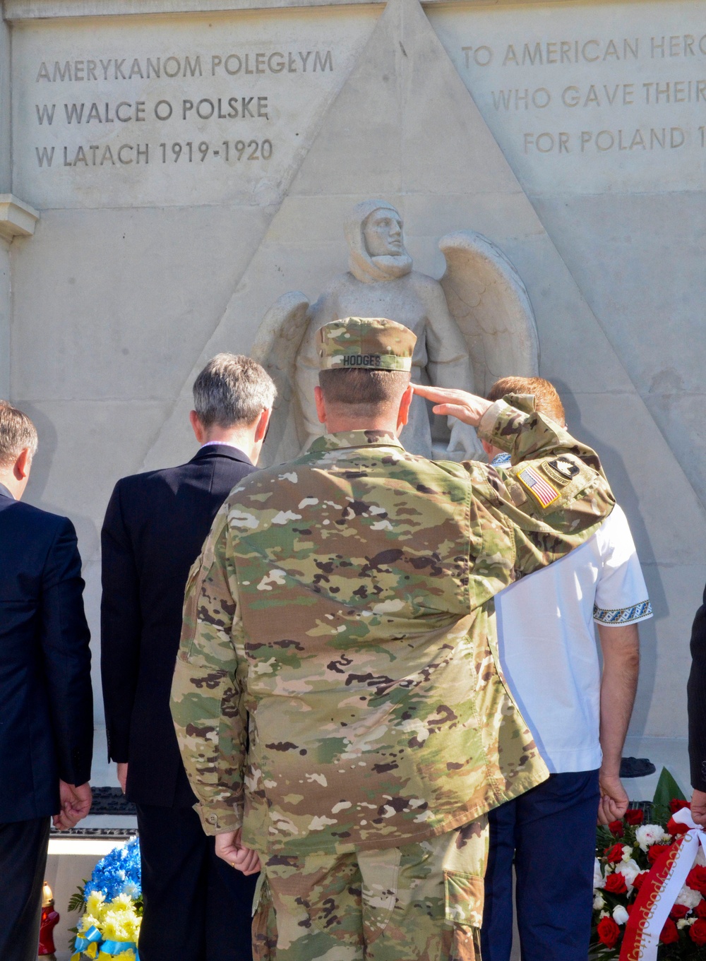 Lt. Gen. Hodges salutes at the memorial of three U.S. Airmen