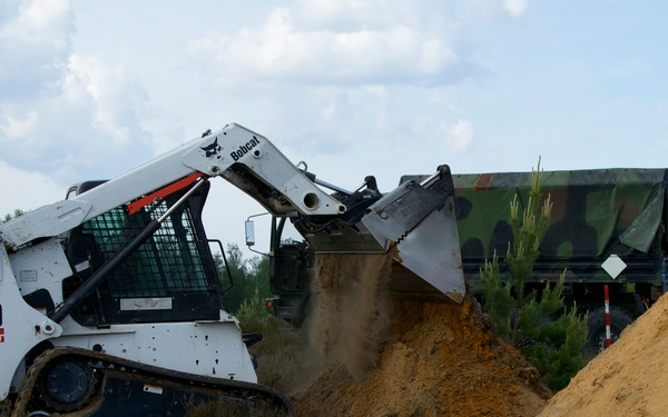 Latvian Engineer build berms for barriers