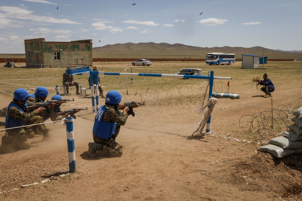 Service members with the Malaysian Army participate in riot control training during Khaan Quest 2016